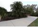 Brick home with attached garage and lush landscaping at 4428 Sugartree E Dr, Lakeland, FL 33813