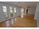 Open living room with hardwood floors and access to other rooms at 4428 Sugartree E Dr, Lakeland, FL 33813