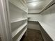Spacious walk-in closet with built-in shelves at 4428 Sugartree E Dr, Lakeland, FL 33813