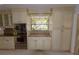 Kitchen with cream cabinets and granite countertops at 4428 Sugartree E Dr, Lakeland, FL 33813