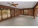Brick patio with ceiling fans and access to sunroom at 4428 Sugartree E Dr, Lakeland, FL 33813
