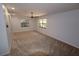 Bright living room with neutral carpeting and ceiling fan at 4428 Sugartree E Dr, Lakeland, FL 33813