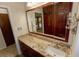 Bathroom with granite countertop and large mirror at 4428 Sugartree E Dr, Lakeland, FL 33813