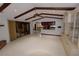 Open living area with kitchen view and built-in shelving at 4428 Sugartree E Dr, Lakeland, FL 33813