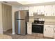 Modern kitchen with stainless steel appliances and granite countertops at 608 Lark Dr, Lakeland, FL 33813