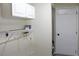 Laundry room with cabinets and shelving at 608 Lark Dr, Lakeland, FL 33813