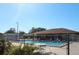 Community pool with lounge chairs and a fenced area at 608 Lark Dr, Lakeland, FL 33813