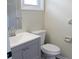 Updated bathroom with gray vanity and white toilet at 608 Lark Dr, Lakeland, FL 33813