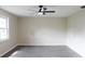 Spacious living room featuring neutral walls and wood-look floors at 608 Lark Dr, Lakeland, FL 33813