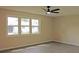 Well-lit bedroom with large windows and wood-look floors at 608 Lark Dr, Lakeland, FL 33813