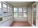 Enclosed porch with multiple windows at 608 Lark Dr, Lakeland, FL 33813