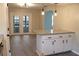 Kitchen with breakfast bar, granite countertops, and white cabinets at 608 Lark Dr, Lakeland, FL 33813