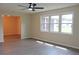 Living room showcasing large windows and light flooring at 608 Lark Dr, Lakeland, FL 33813