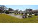 Community shuffleboard court with benches and lush landscaping at 608 Lark Dr, Lakeland, FL 33813
