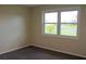 Bright bedroom with neutral walls and carpet at 608 Lark Dr, Lakeland, FL 33813