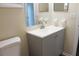 Bathroom featuring a gray vanity and chrome fixtures at 608 Lark Dr, Lakeland, FL 33813
