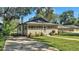 Updated bungalow with a screened porch and spacious yard at 1127 N Stella Ave, Lakeland, FL 33805