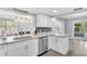 Updated kitchen with white cabinets, granite countertops and stainless steel appliances at 2233 20Th Nw St, Winter Haven, FL 33881