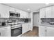 Modern kitchen with stainless steel appliances and granite countertops at 2233 20Th Nw St, Winter Haven, FL 33881