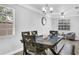 Dining area with a dark wood table and comfortable seating at 2233 20Th Nw St, Winter Haven, FL 33881