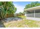 Large backyard with screened porch and fence at 2233 20Th Nw St, Winter Haven, FL 33881