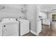Laundry room with washer, dryer, and overhead shelving at 2233 20Th Nw St, Winter Haven, FL 33881