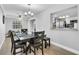 Dining room with a dark wood table and chairs, open to kitchen at 2233 20Th Nw St, Winter Haven, FL 33881