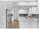 Modern kitchen with white shaker cabinets, granite countertops and stainless steel appliances at 2233 20Th Nw St, Winter Haven, FL 33881