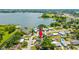 Aerial view of a single-Gathering home near a lake at 2233 20Th Nw St, Winter Haven, FL 33881