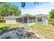 House exterior showcasing screened porch and backyard at 2233 20Th Nw St, Winter Haven, FL 33881