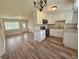 Bright kitchen features white cabinets, granite countertops, and modern appliances at 1224 Morgan Dr, Lakeland, FL 33801