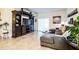 Spacious living room featuring a large sectional sofa and an entertainment center at 731 Griffon Ave, Lake Alfred, FL 33850