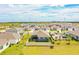 Aerial view of houses and community at 731 Griffon Ave, Lake Alfred, FL 33850