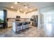 Modern kitchen with white cabinets, granite island, and stainless steel appliances at 731 Griffon Ave, Lake Alfred, FL 33850