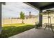 Covered patio with table and chairs at 731 Griffon Ave, Lake Alfred, FL 33850