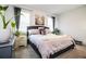 Spacious bedroom with a comfortable bed and plenty of natural light at 731 Griffon Ave, Lake Alfred, FL 33850