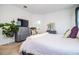 Main bedroom with a comfortable bed, dresser, and ensuite bathroom access at 731 Griffon Ave, Lake Alfred, FL 33850