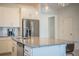 Modern kitchen with granite island and stainless steel appliances at 731 Griffon Ave, Lake Alfred, FL 33850