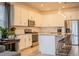 Modern kitchen featuring white cabinets, granite countertops, and stainless steel appliances at 731 Griffon Ave, Lake Alfred, FL 33850