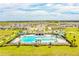Community pool with lounge area at 731 Griffon Ave, Lake Alfred, FL 33850