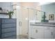 Bathroom with a walk-in shower, granite countertop, and white cabinets at 731 Griffon Ave, Lake Alfred, FL 33850