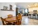 Charming breakfast nook with a round wooden table and chairs, open to the kitchen at 731 Griffon Ave, Lake Alfred, FL 33850