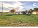 Single story home with a spacious lawn and blue door at 5144 Washington St, Lake Wales, FL 33859