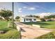 Ranch style home with blue accents and spacious yard at 5144 Washington St, Lake Wales, FL 33859