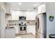 Modern kitchen with white cabinets and granite countertops at 5144 Washington St, Lake Wales, FL 33859