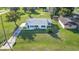 Aerial view of a charming single story home with a well-maintained lawn at 5144 Washington St, Lake Wales, FL 33859