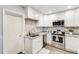 Modern kitchen with white cabinets and granite countertops at 5144 Washington St, Lake Wales, FL 33859