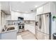 Modern kitchen with white cabinets and granite countertops at 5144 Washington St, Lake Wales, FL 33859