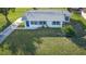 An aerial view showcasing a single-story home with a front yard at 5144 Washington St, Lake Wales, FL 33859