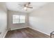 Cozy bedroom with large window and ceiling fan at 5144 Washington St, Lake Wales, FL 33859